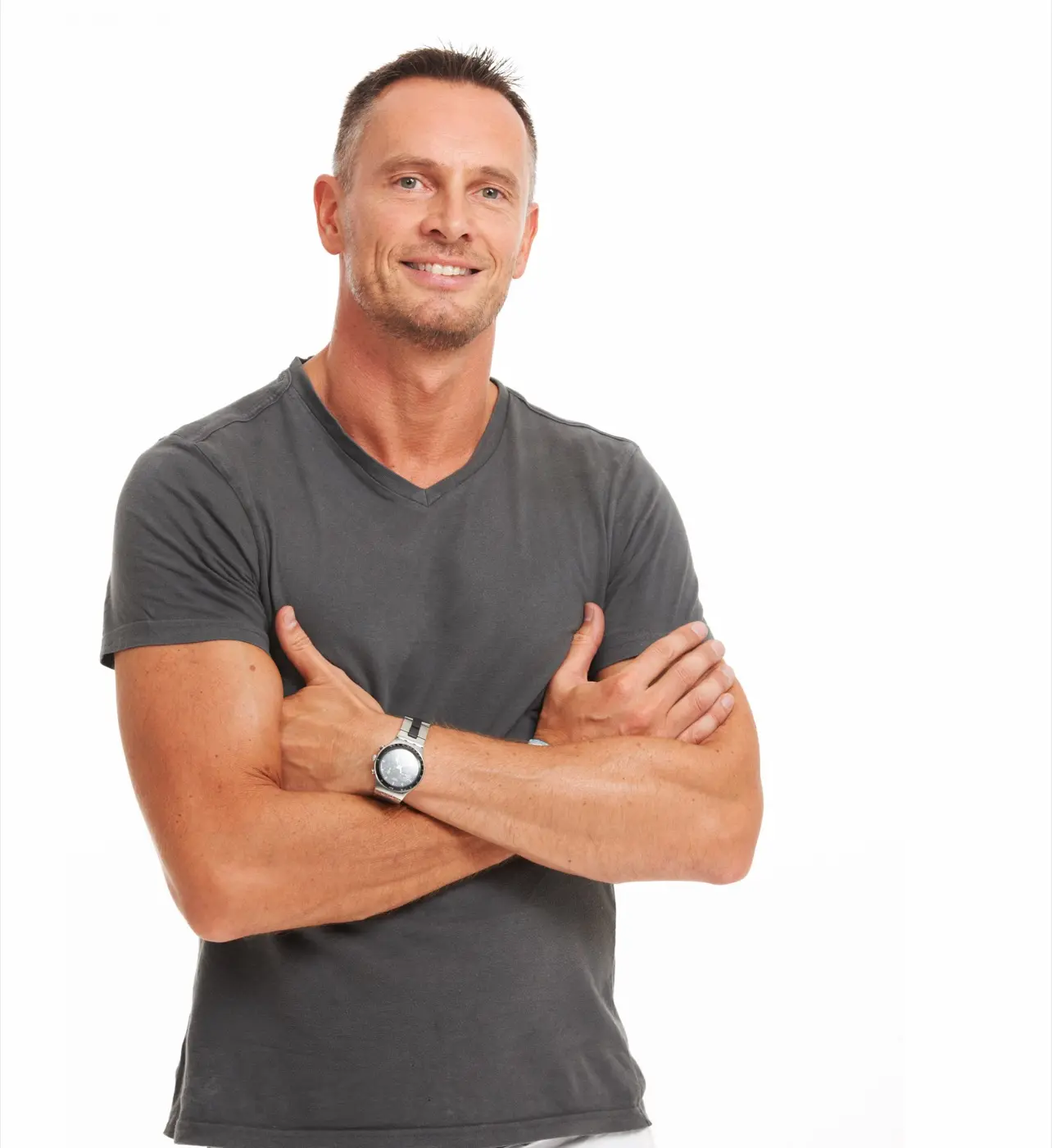 Man standing with his arms crossed and smiling