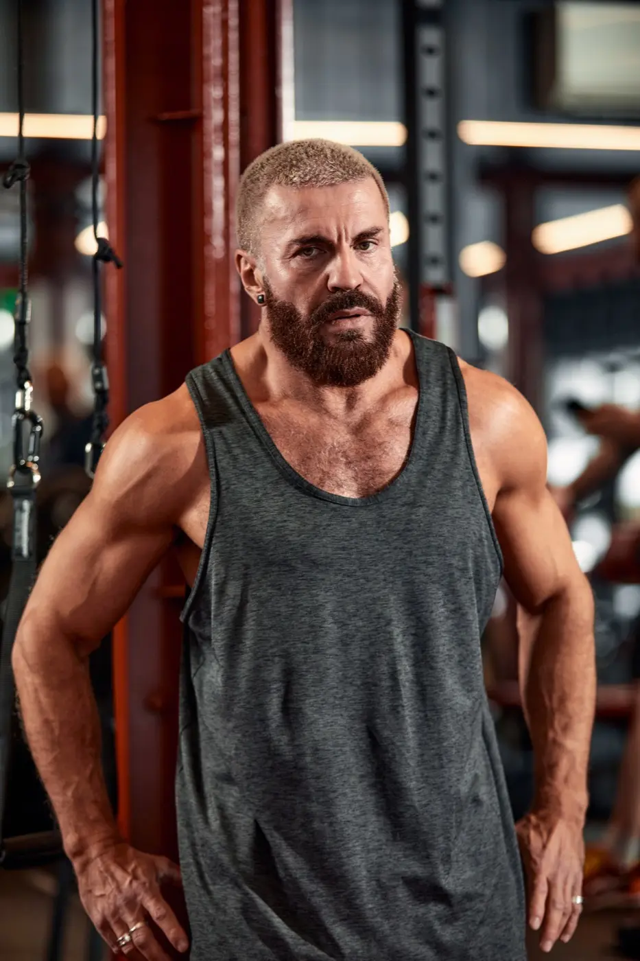 Man training his arms and chest in a gym